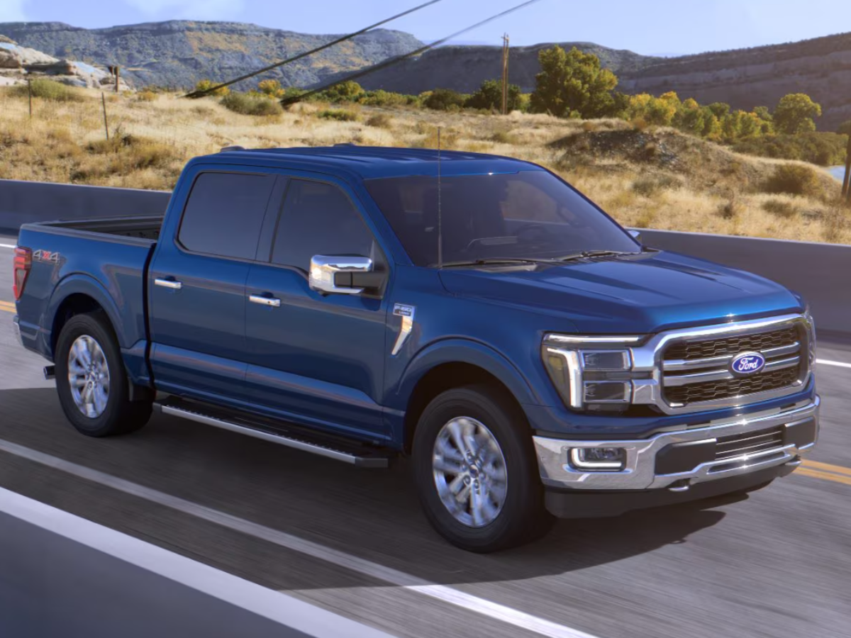 Blue Ford F-150 on the road